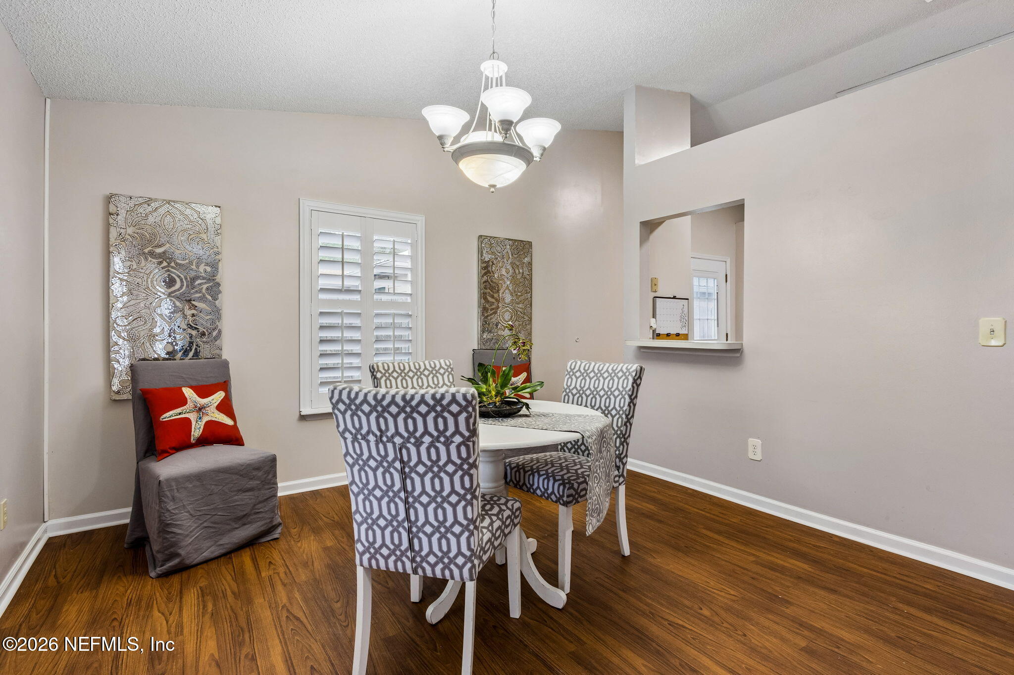 12648 Moose Road Jacksonville, FL 32226 - Photo 18 of 38 a dining room with furniture and wooden floor