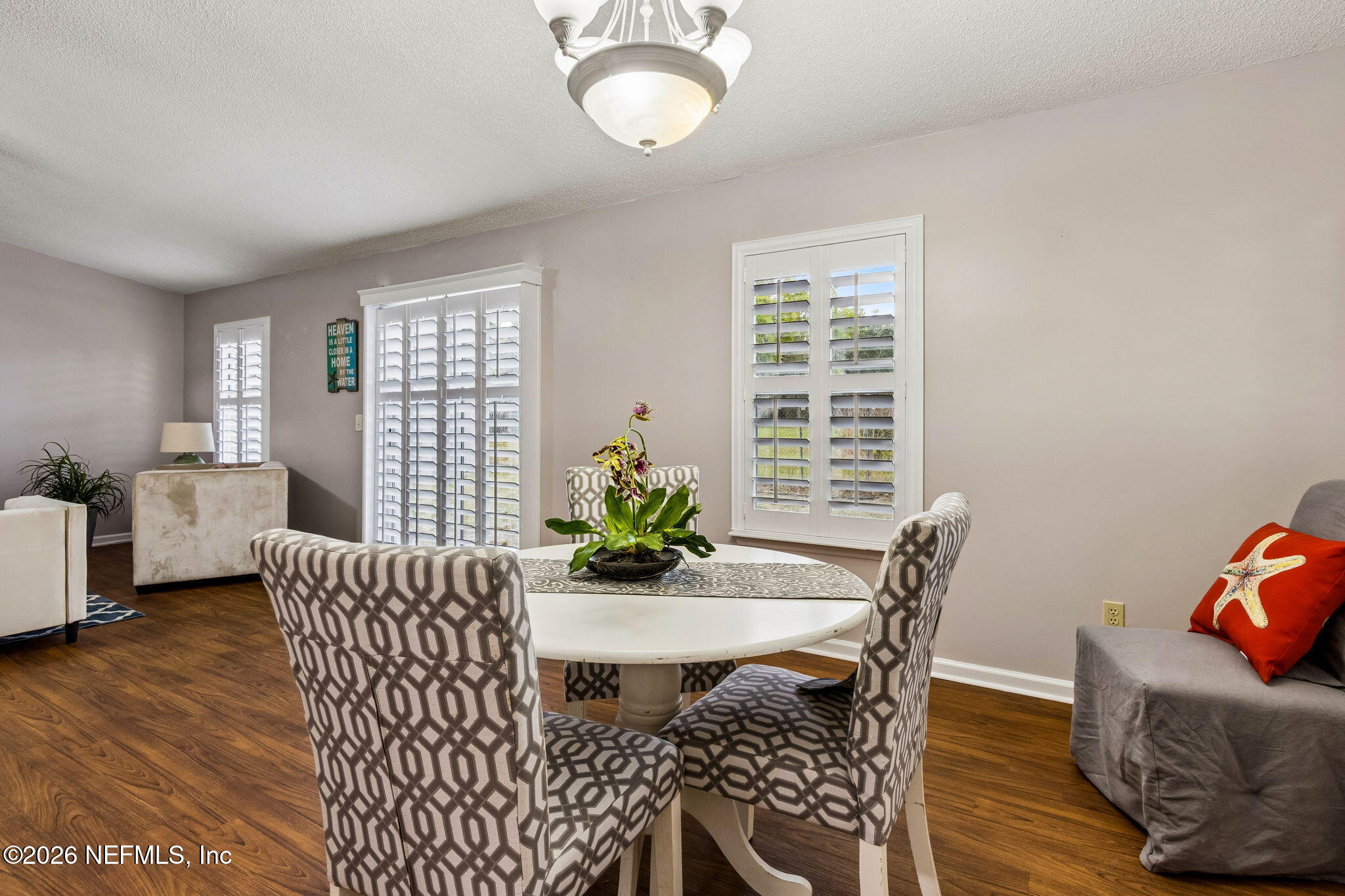 12648 Moose Road Jacksonville, FL 32226 - Photo 20 of 38 a view of a dining room with furniture and wooden floor