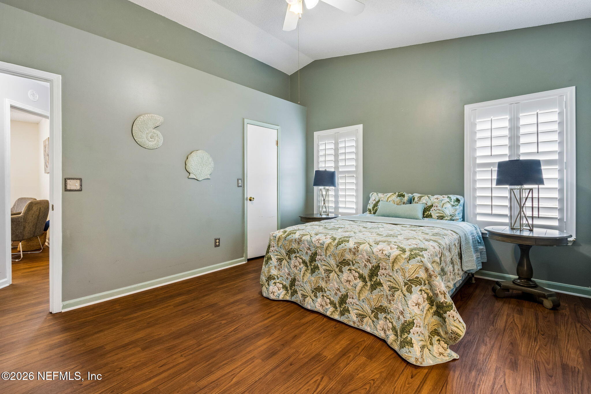 12648 Moose Road Jacksonville, FL 32226 - Photo 23 of 38 a bedroom with a bed and a wooden floor