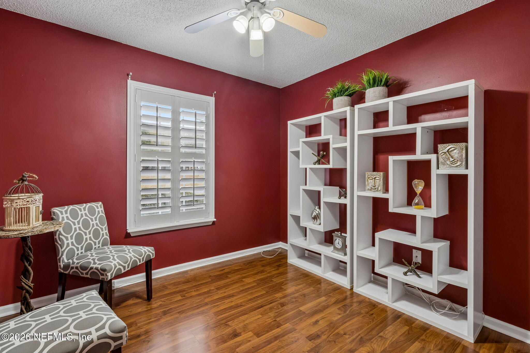 12648 Moose Road Jacksonville, FL 32226 - Photo 27 of 38 a room with furniture and a book shelf