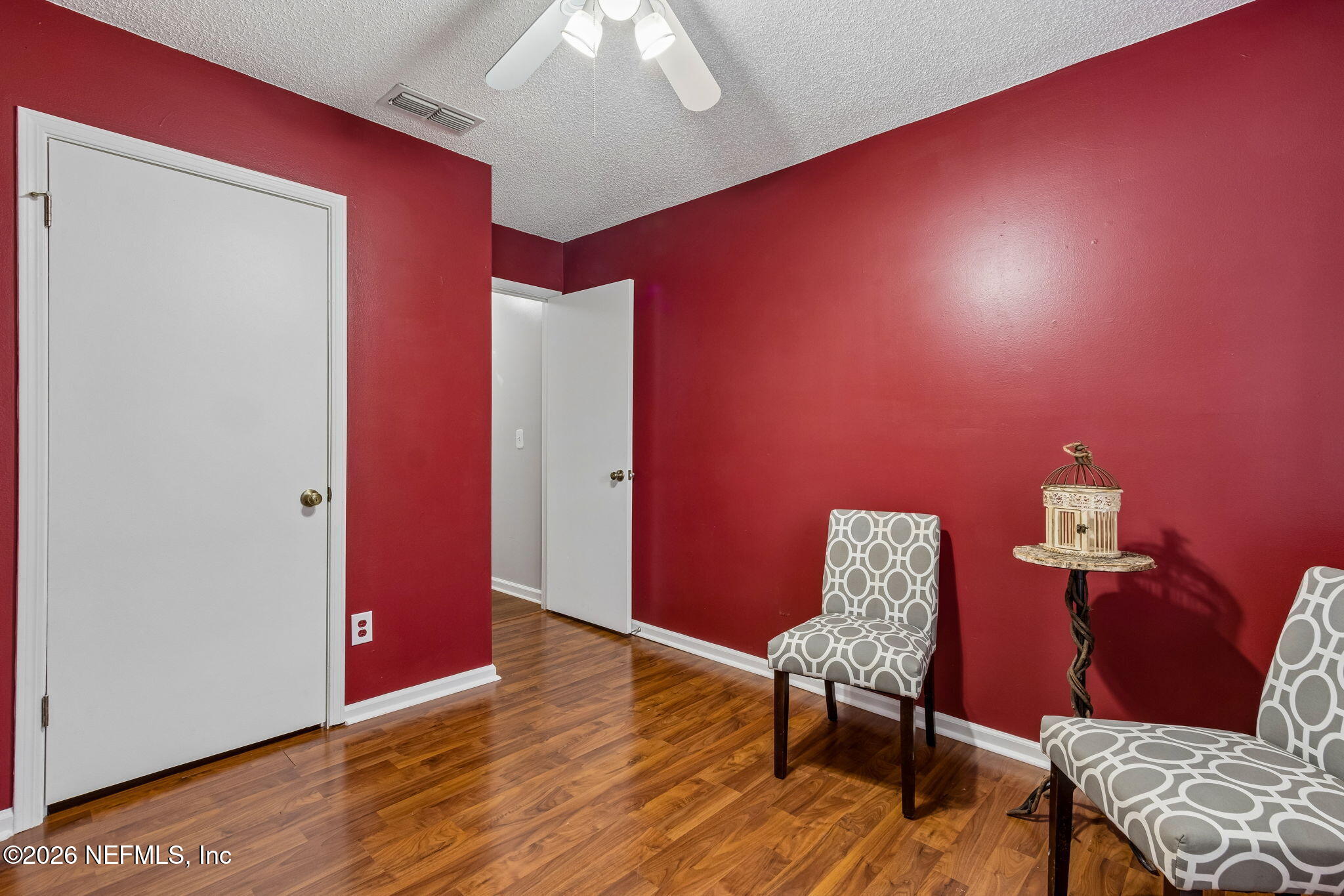 12648 Moose Road Jacksonville, FL 32226 - Photo 28 of 38 a living room with furniture and wooden floor