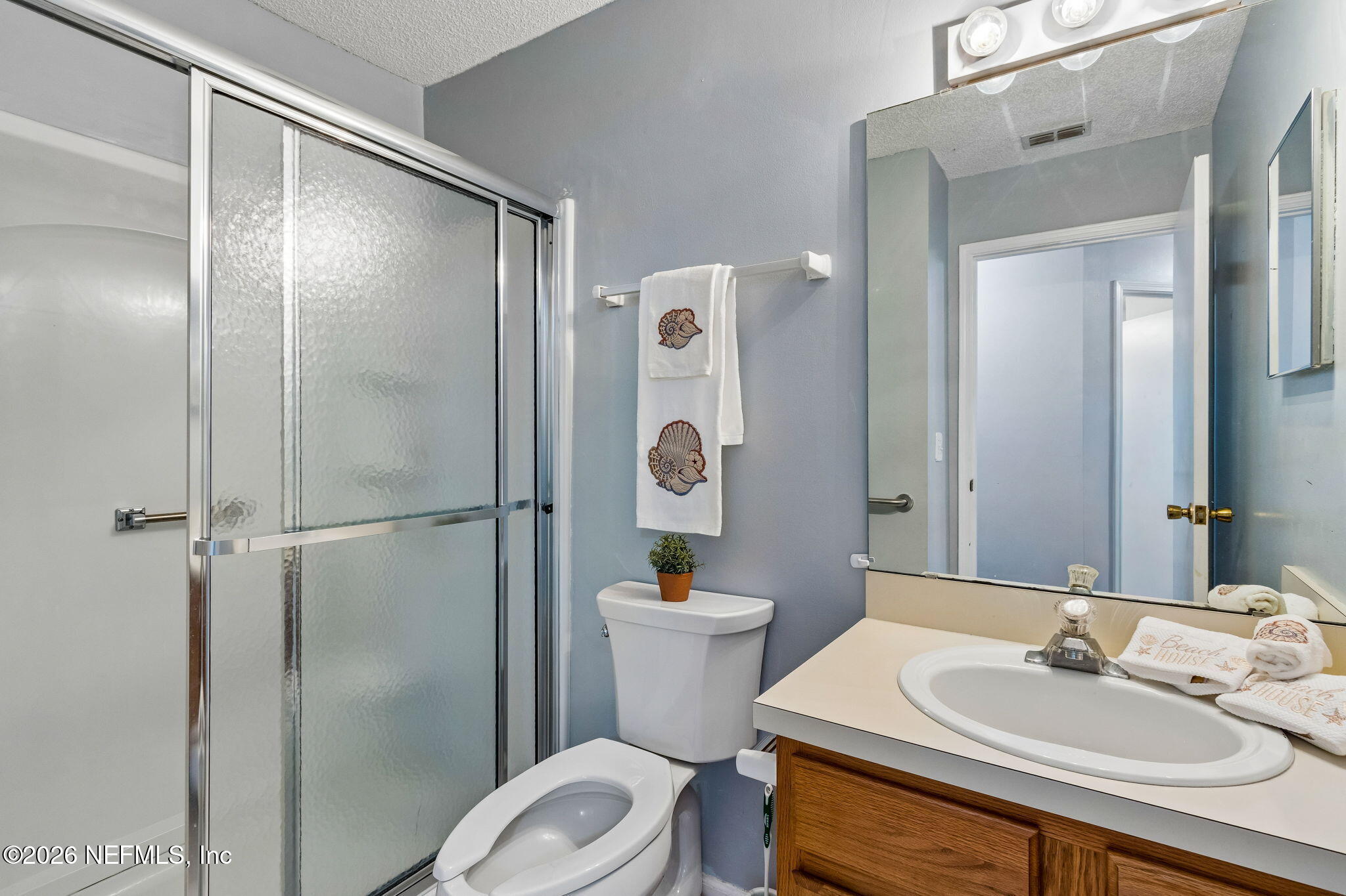 12648 Moose Road Jacksonville, FL 32226 - Photo 29 of 38 a bathroom with a sink toilet and shower