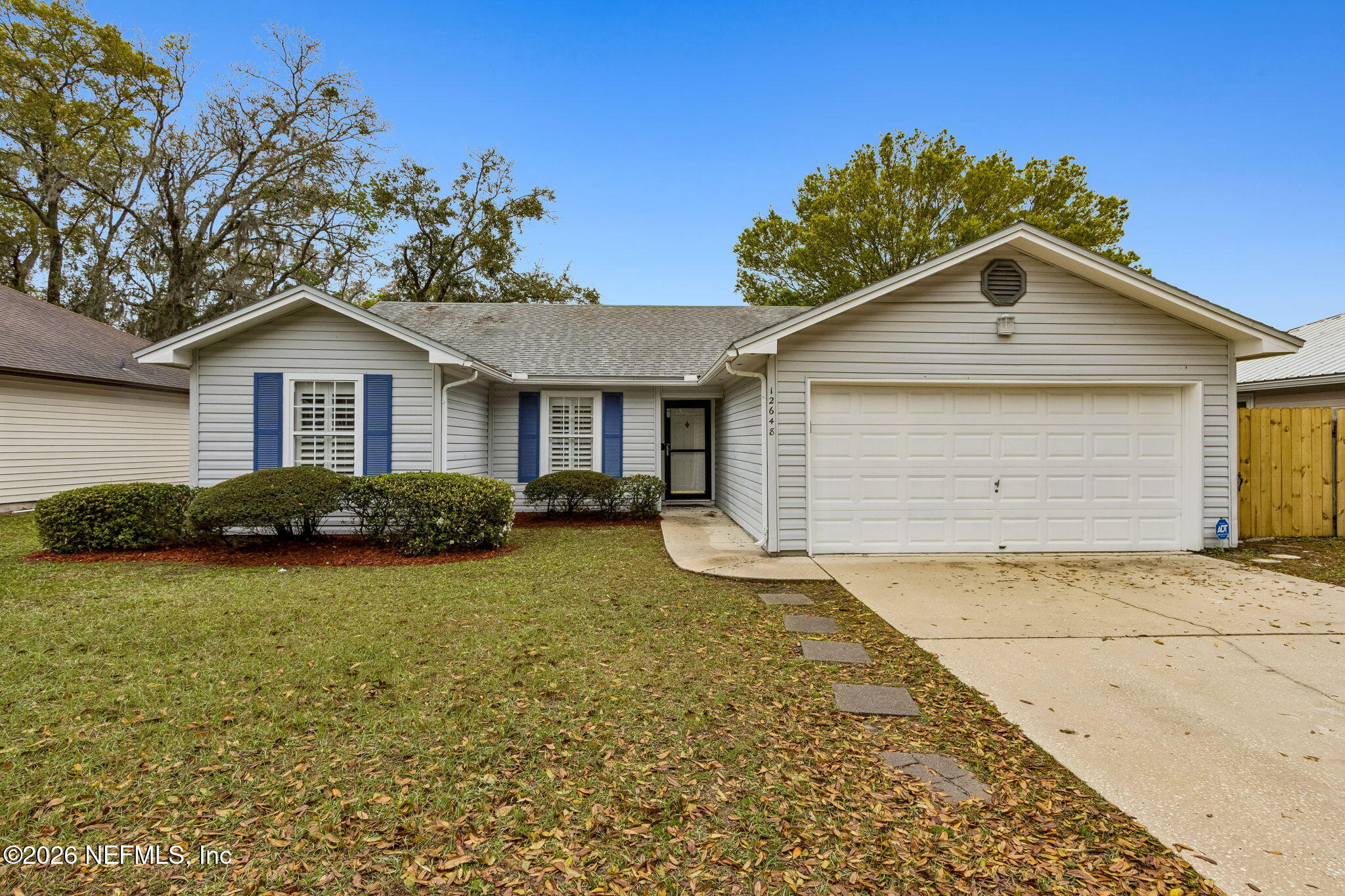 12648 Moose Road Jacksonville, FL 32226 - Photo 3 of 38 a view of a house with a yard and potted plants