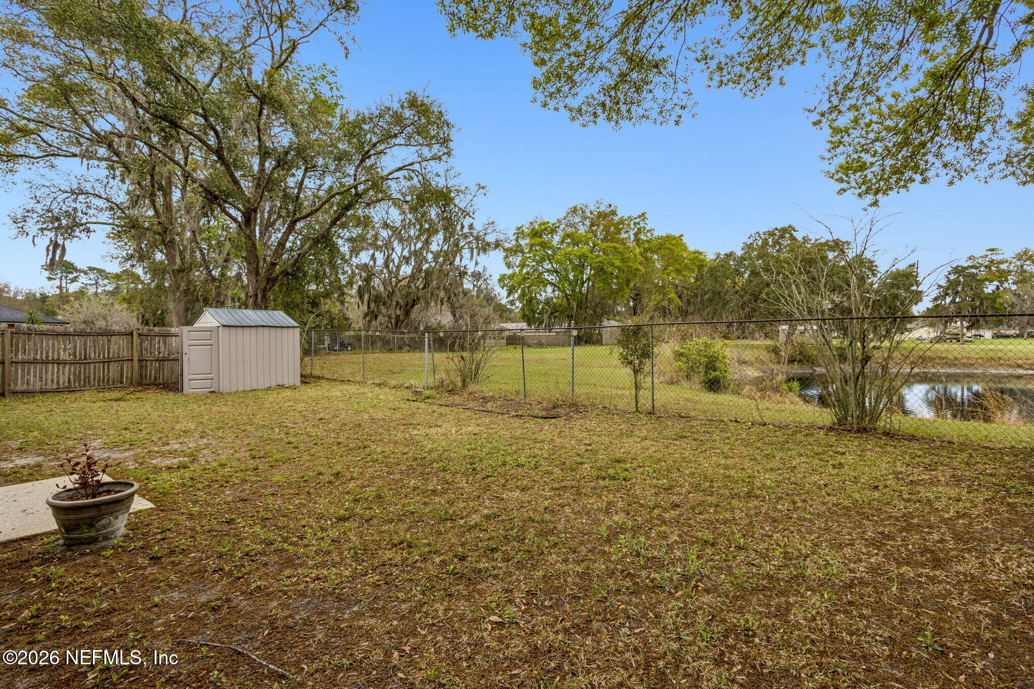 12648 Moose Road Jacksonville, FL 32226 - Photo 34 of 38 a backyard of a house with lots of green space
