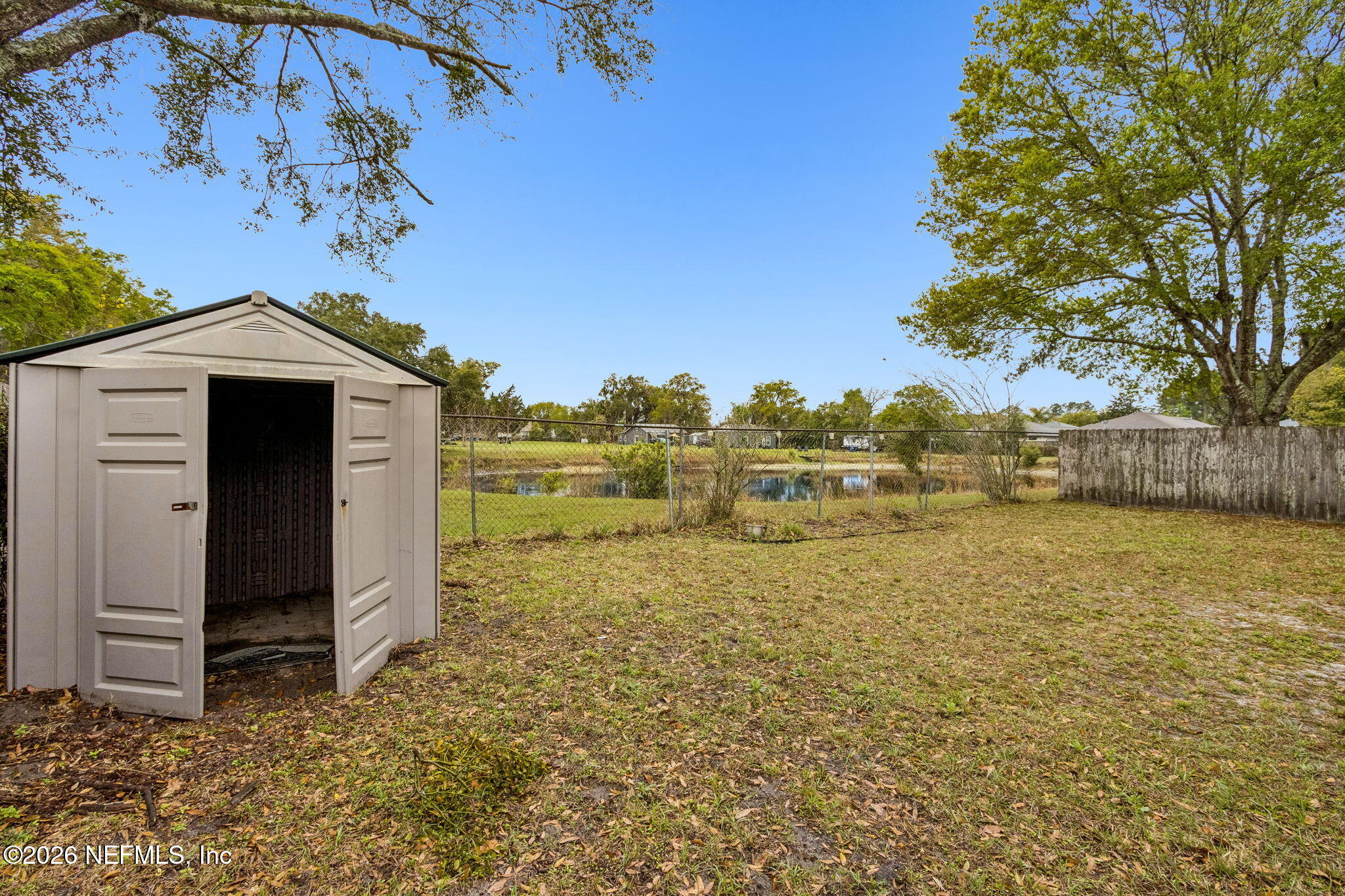 12648 Moose Road Jacksonville, FL 32226 - Photo 35 of 38 a view of a lake with a house in the background