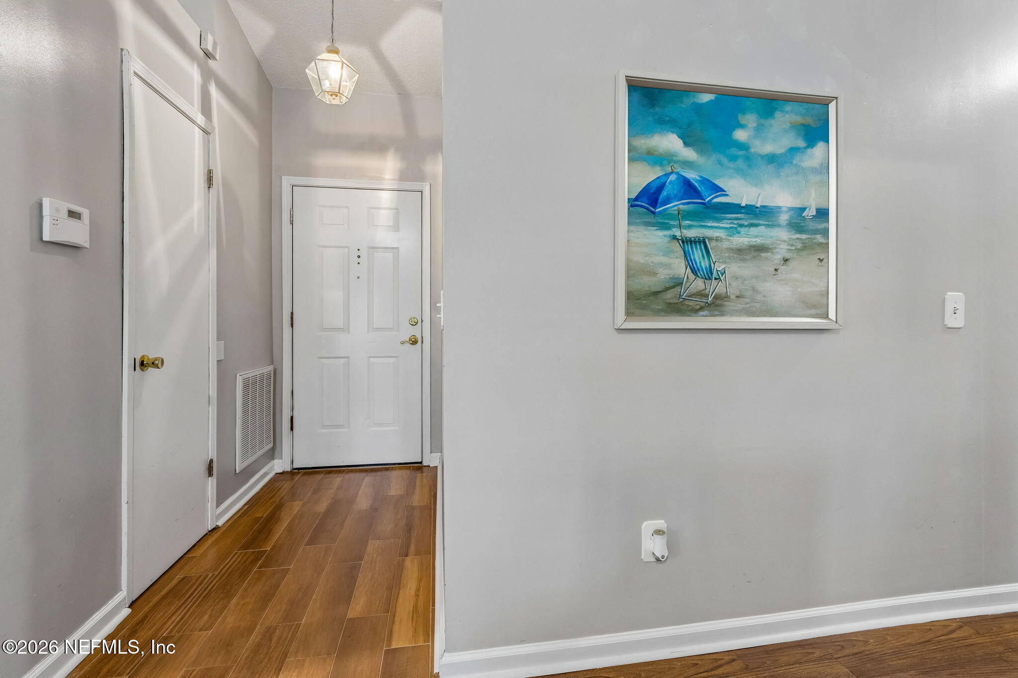 12648 Moose Road Jacksonville, FL 32226 - Photo 6 of 38 a view of room with wooden floor