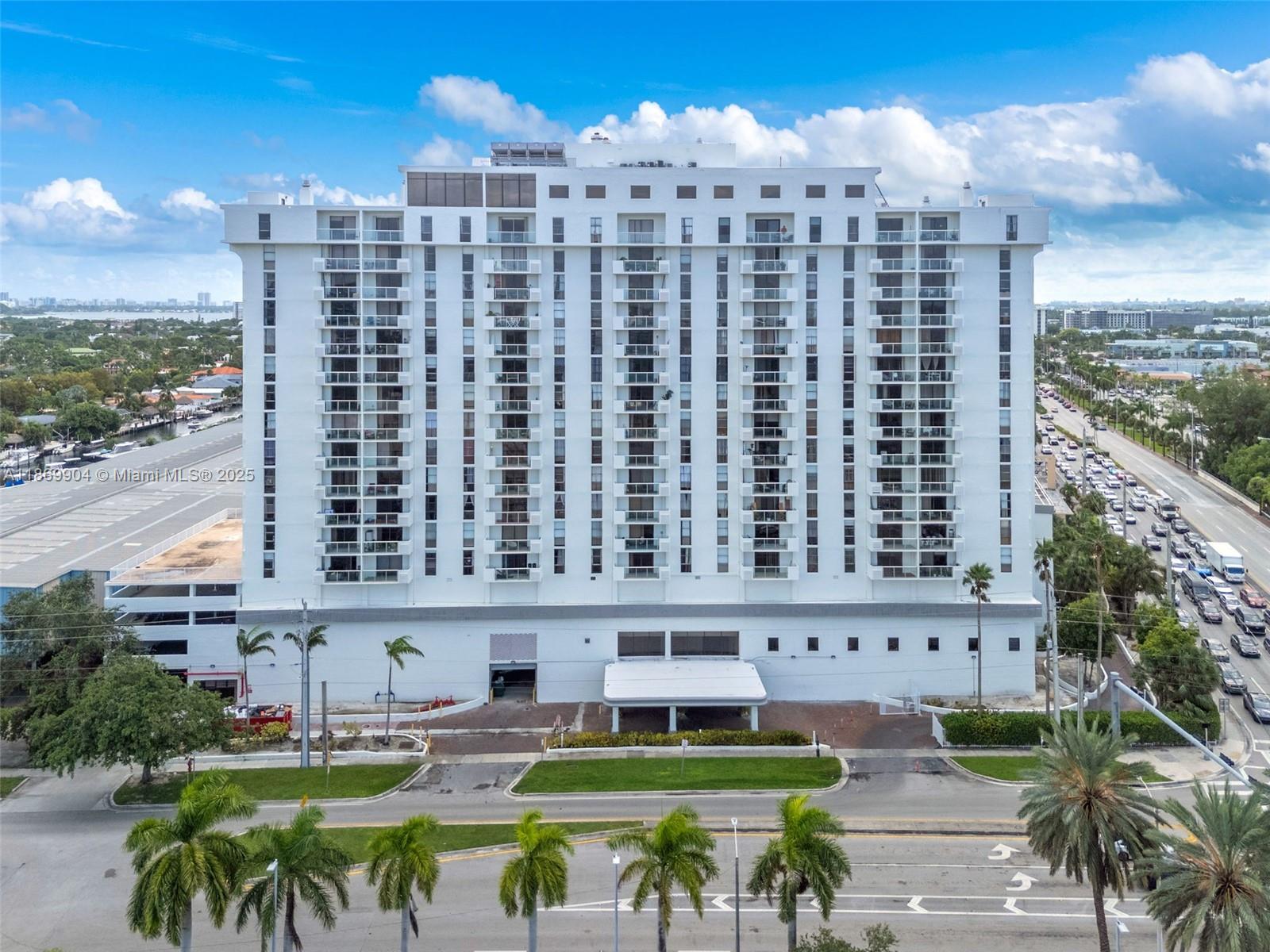 13499 Biscayne Boulevard, Unit 403 North Miami, FL 33181 - Photo 1 of 31 a view of a chairs and table in a patio