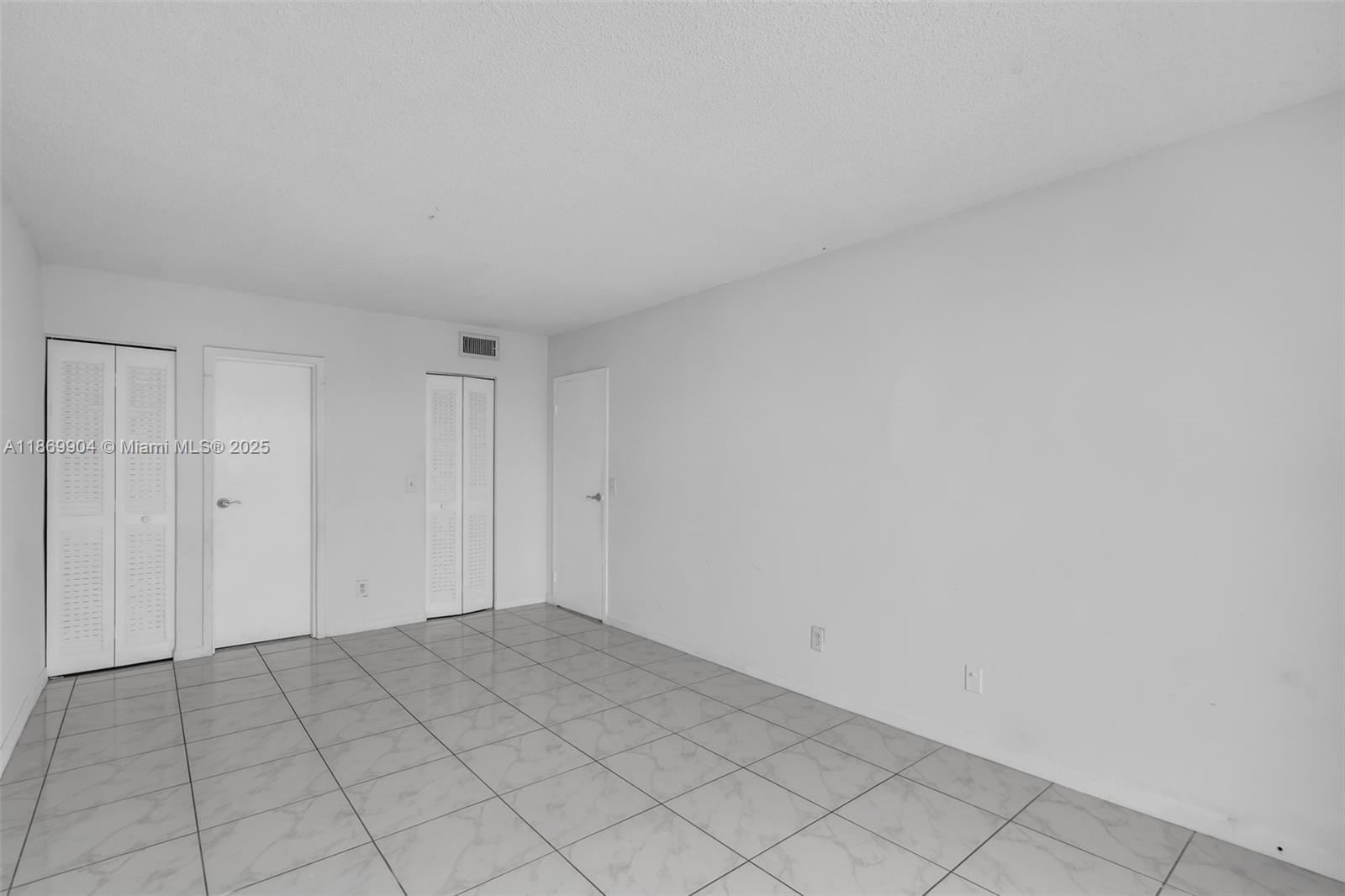 13499 Biscayne Boulevard, Unit 403 North Miami, FL 33181 - Photo 13 of 31 a view of an empty room