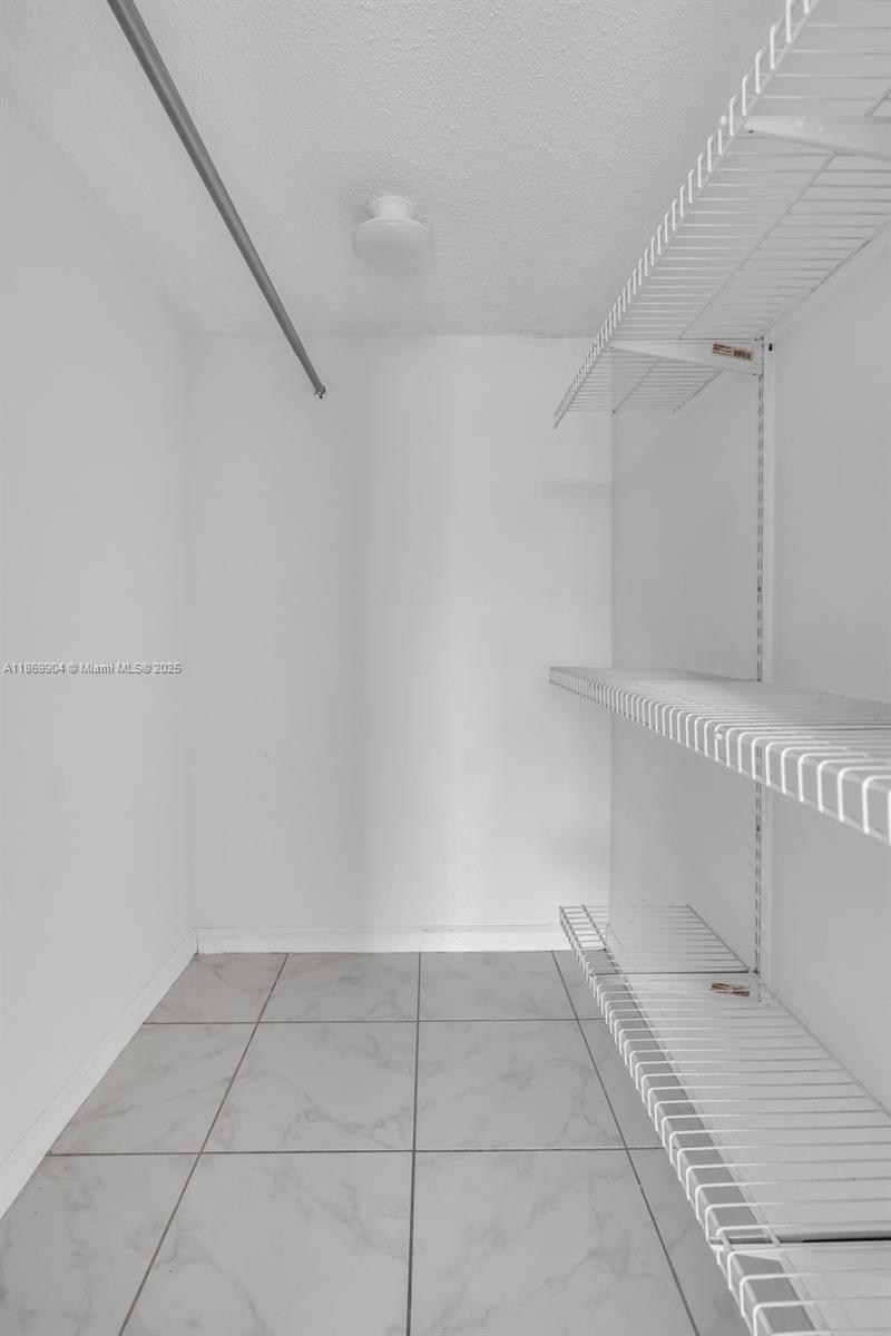 13499 Biscayne Boulevard, Unit 403 North Miami, FL 33181 - Photo 17 of 31 a view of an empty walk in closet
