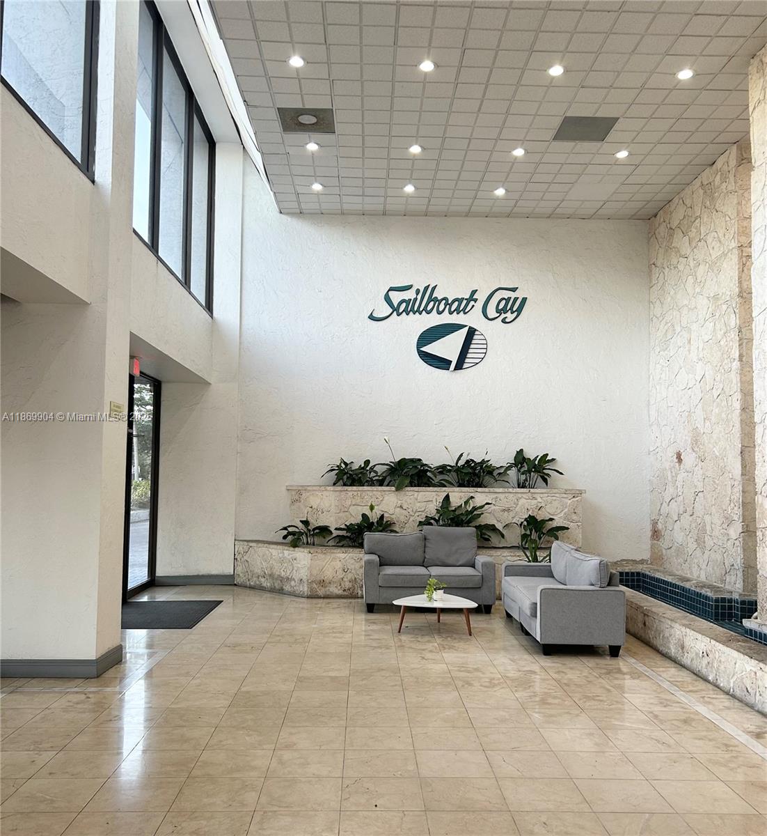 13499 Biscayne Boulevard, Unit 403 North Miami, FL 33181 - Photo 2 of 31 a living room with furniture