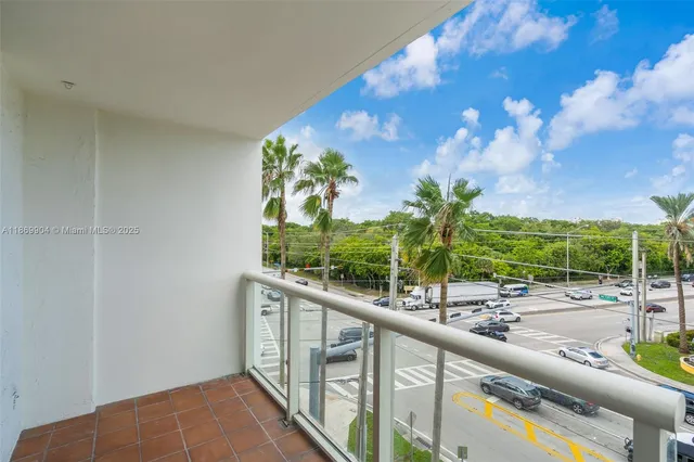 a view of a balcony with lake view and a potted plant