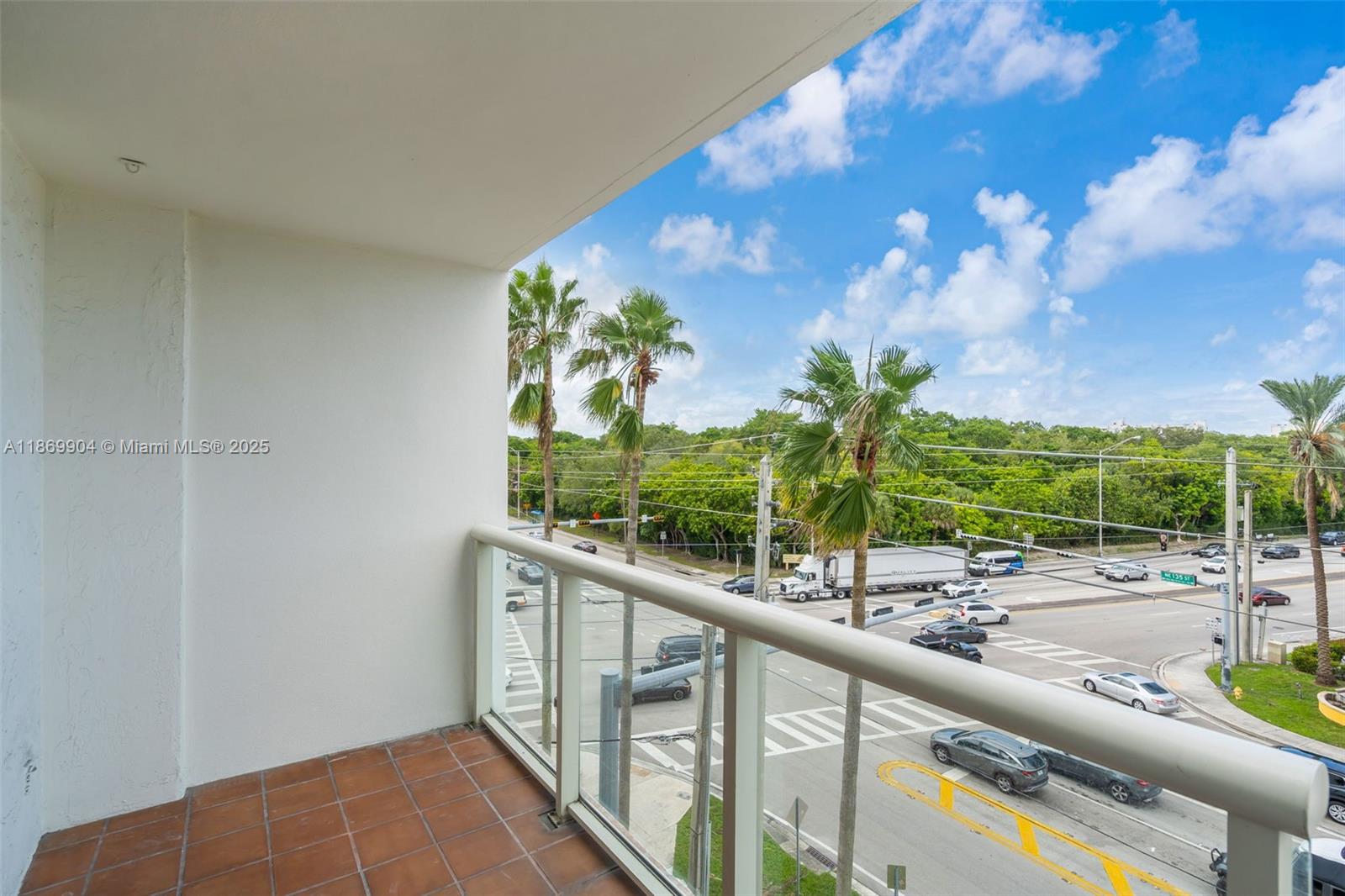 13499 Biscayne Boulevard, Unit 403 North Miami, FL 33181 - Photo 21 of 31 a view of a balcony with lake view and a potted plant