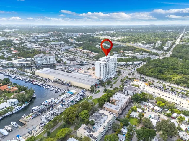 a view of a hall with floor to ceiling windows