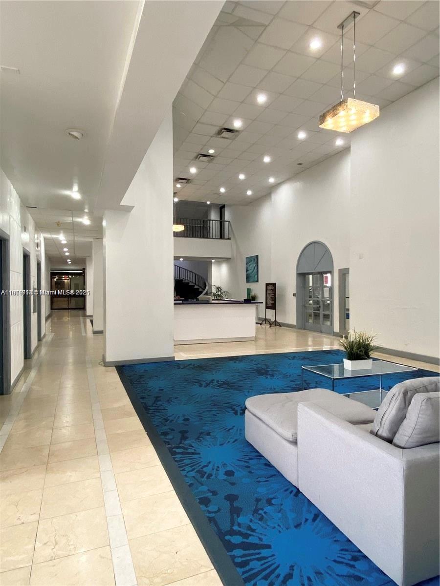13499 Biscayne Boulevard, Unit 403 North Miami, FL 33181 - Photo 3 of 31 a lobby with furniture and a potted plant