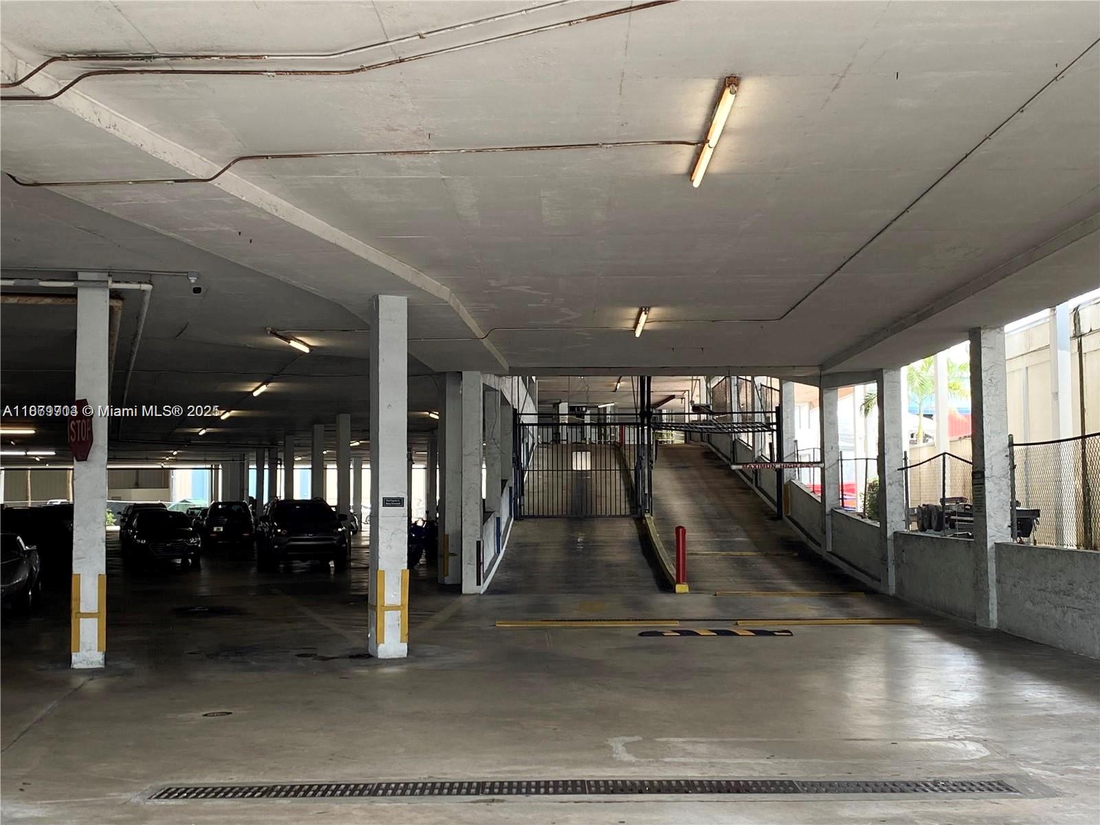 13499 Biscayne Boulevard, Unit 403 North Miami, FL 33181 - Photo 31 of 31 a view of a hall with floor to ceiling windows