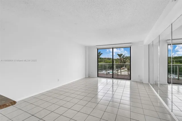 a view of an empty room with windows