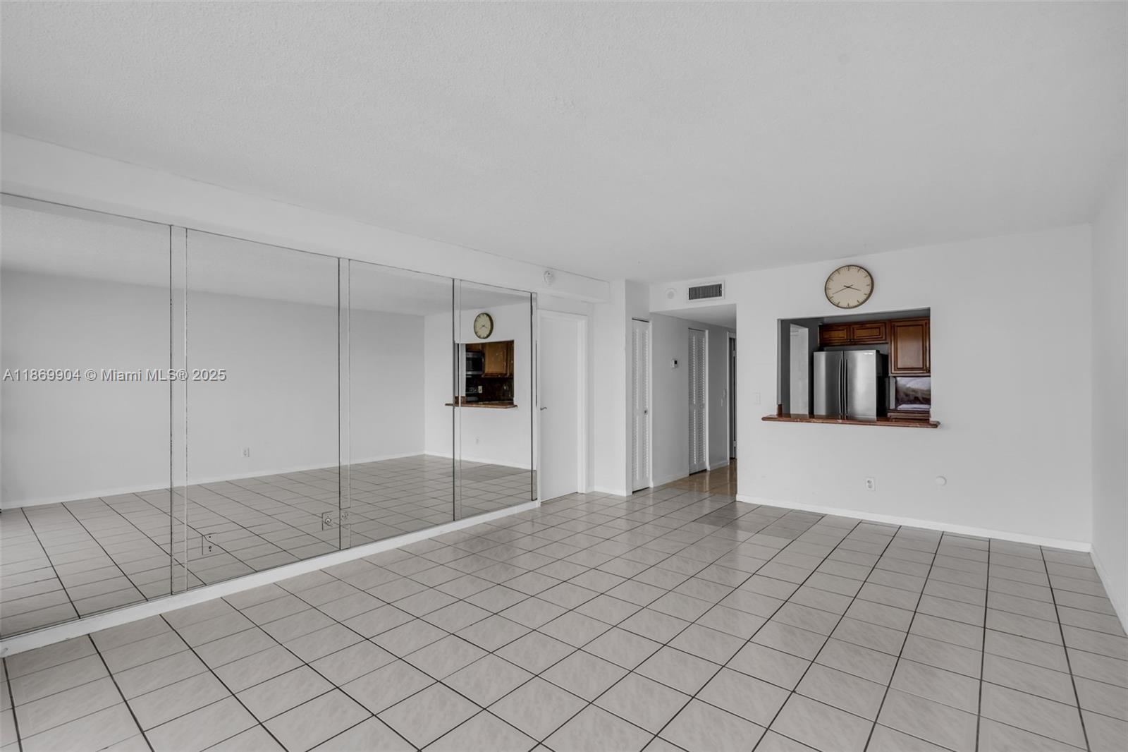 13499 Biscayne Boulevard, Unit 403 North Miami, FL 33181 - Photo 5 of 31 a view of an empty room