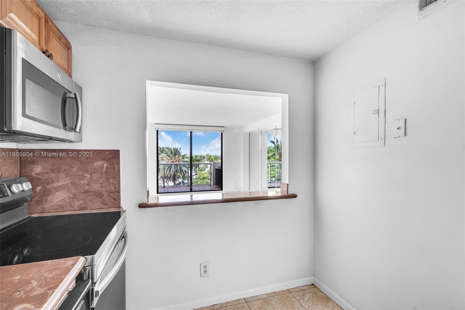 13499 Biscayne Boulevard, Unit 403 North Miami, FL 33181 - Photo 10 of 31 a view of an empty room with a window