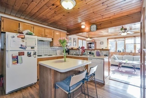 a dinning table and chairs in a room