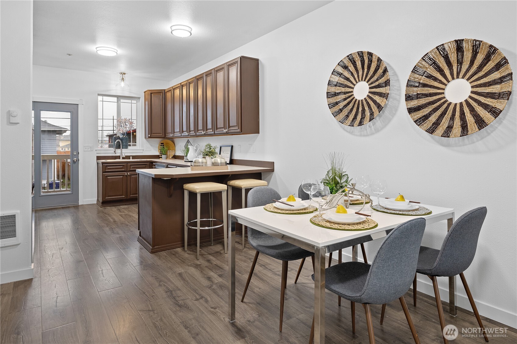 5621 South Lawrence Street, Unit C Tacoma, WA 98409 - Photo 1 of 29 a view of a dining room with furniture and wooden floor