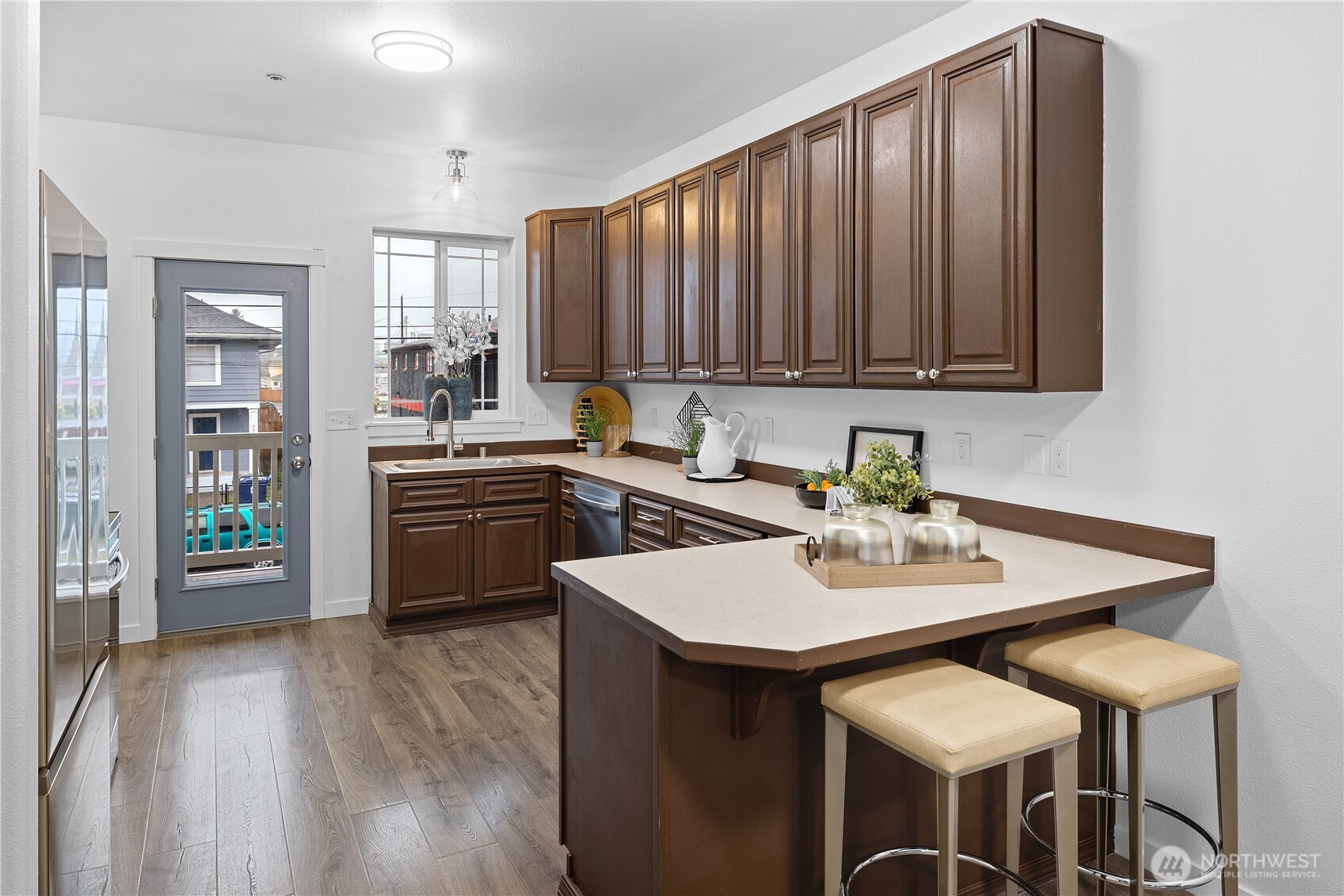 5621 South Lawrence Street, Unit C Tacoma, WA 98409 - Photo 11 of 29 a kitchen with a sink cabinets and wooden floor