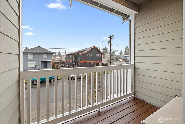 a view of a balcony with wooden fence