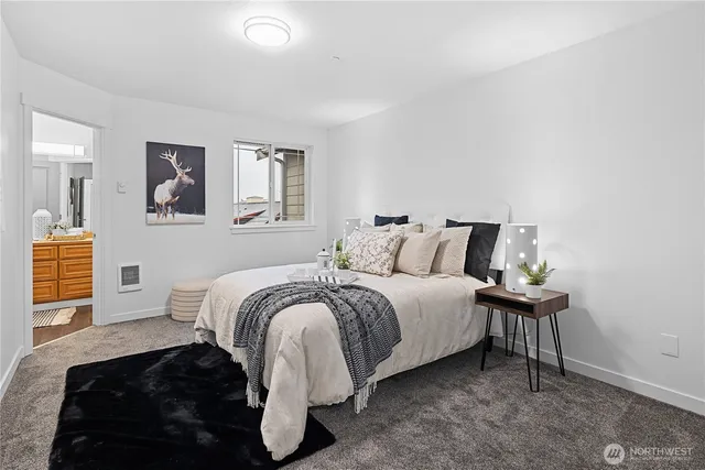 a bedroom with bed and window