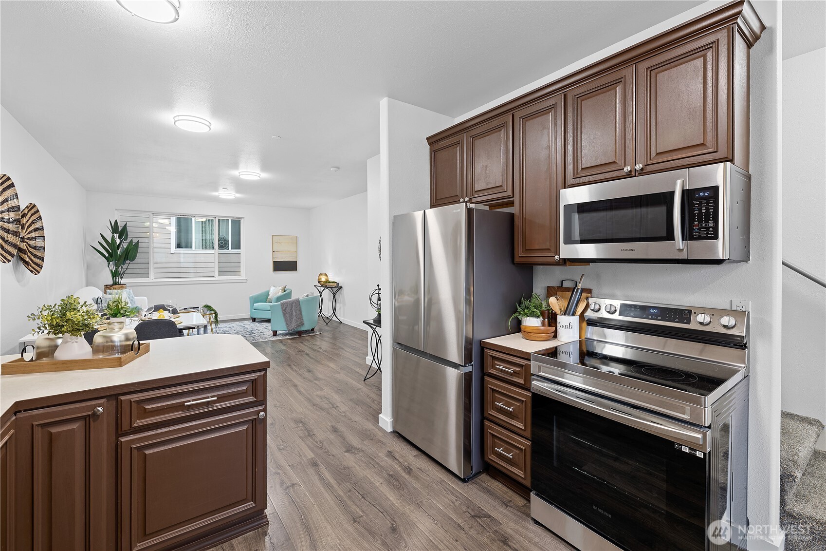 5621 South Lawrence Street, Unit C Tacoma, WA 98409 - Photo 2 of 29 a kitchen with granite countertop a sink stove and refrigerator