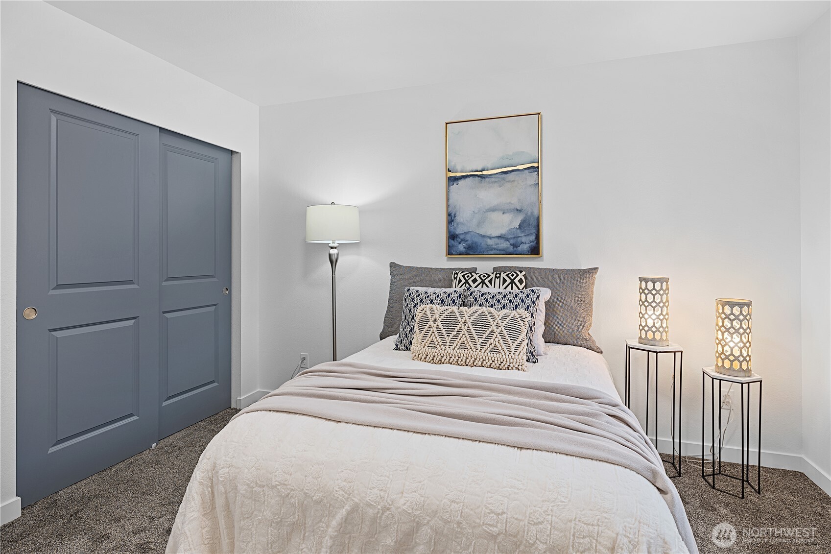 5621 South Lawrence Street, Unit C Tacoma, WA 98409 - Photo 21 of 29 a bedroom with a bed and a painting on the wall