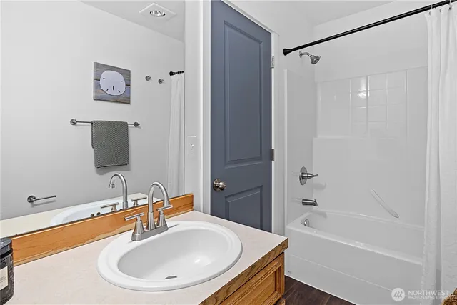 a bathroom with a sink and a bathtub