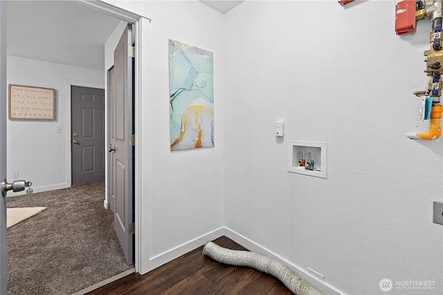 a view of room with window and wooden floor