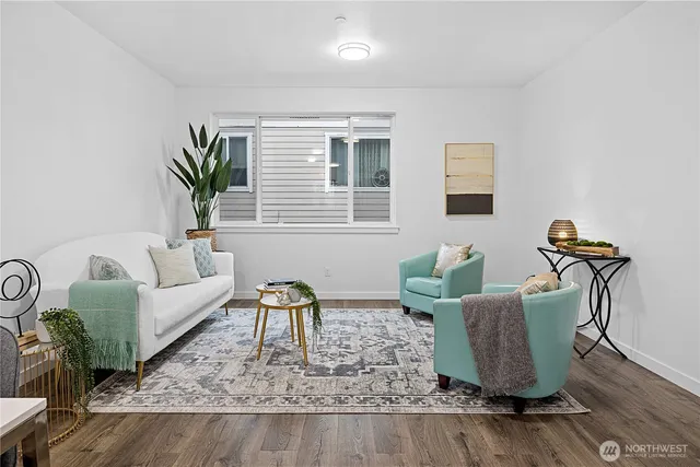 a living room with furniture lamp and window