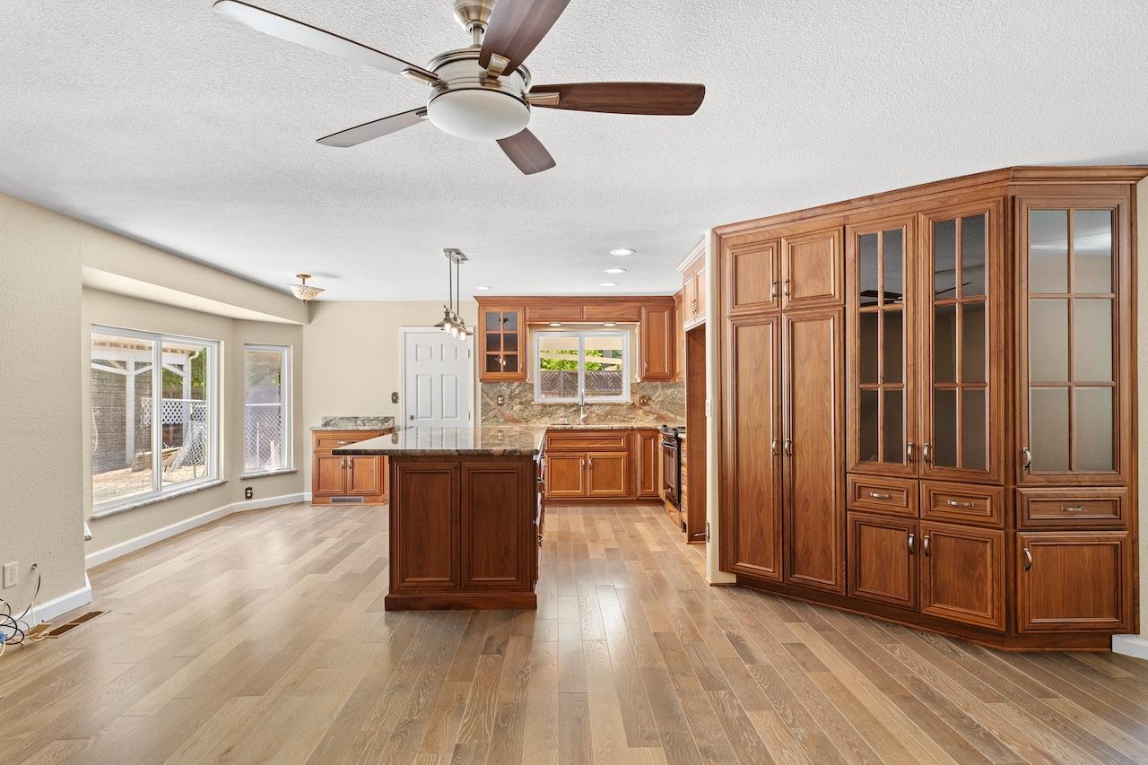 940 Constitution Way Tracy, CA 95376 - Photo 17 of 63 a living room with furniture and wooden floors