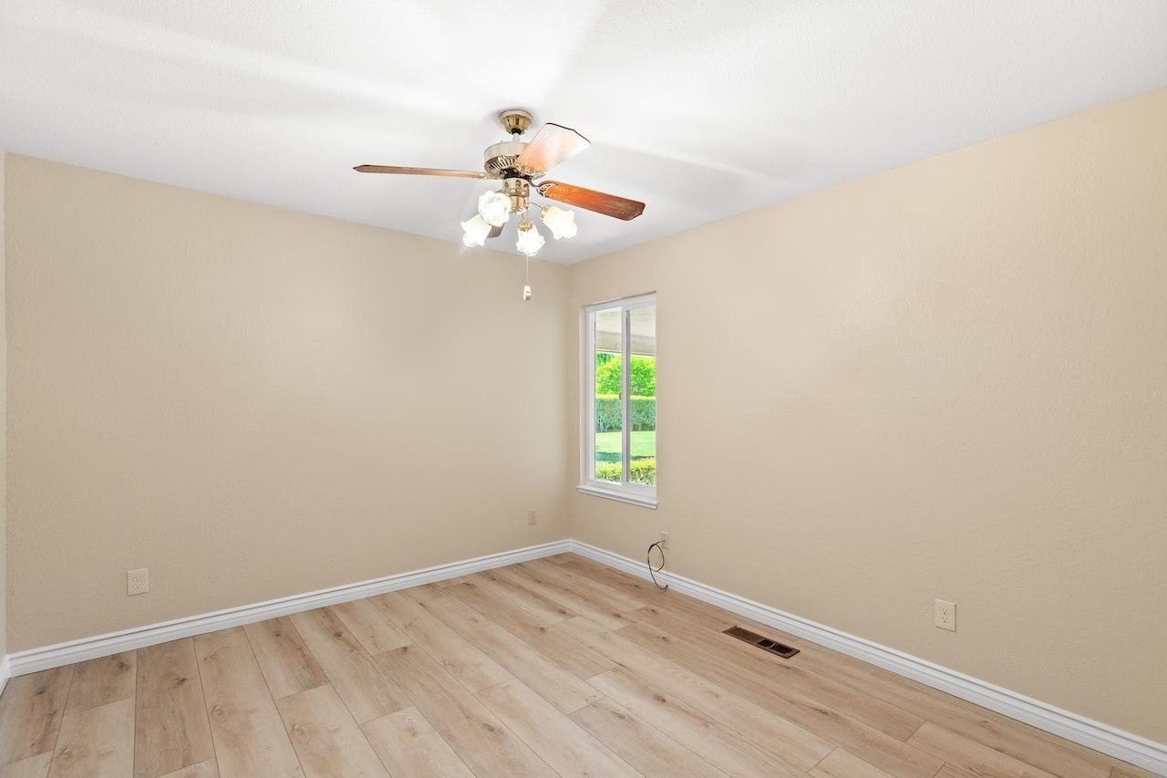 940 Constitution Way Tracy, CA 95376 - Photo 24 of 63 an empty room with windows and fan