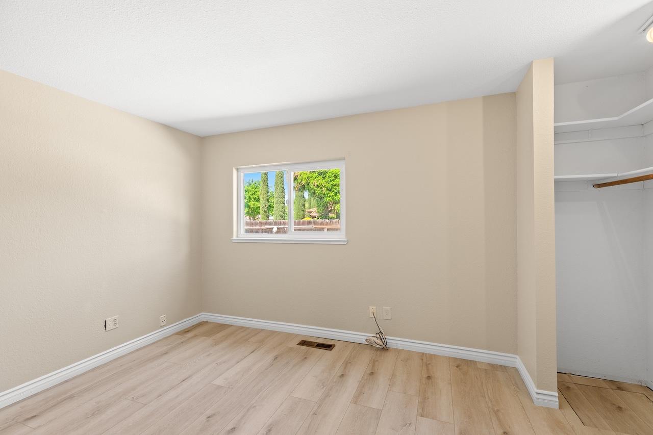 940 Constitution Way Tracy, CA 95376 - Photo 26 of 63 a view of an empty room with wooden floor