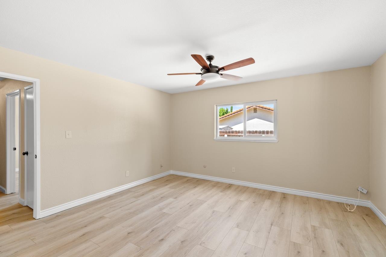 940 Constitution Way Tracy, CA 95376 - Photo 28 of 63 a view of a big room with wooden floor and windows