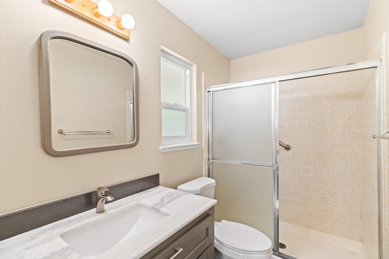 940 Constitution Way Tracy, CA 95376 - Photo 31 of 63 a bathroom with a sink toilet and shower