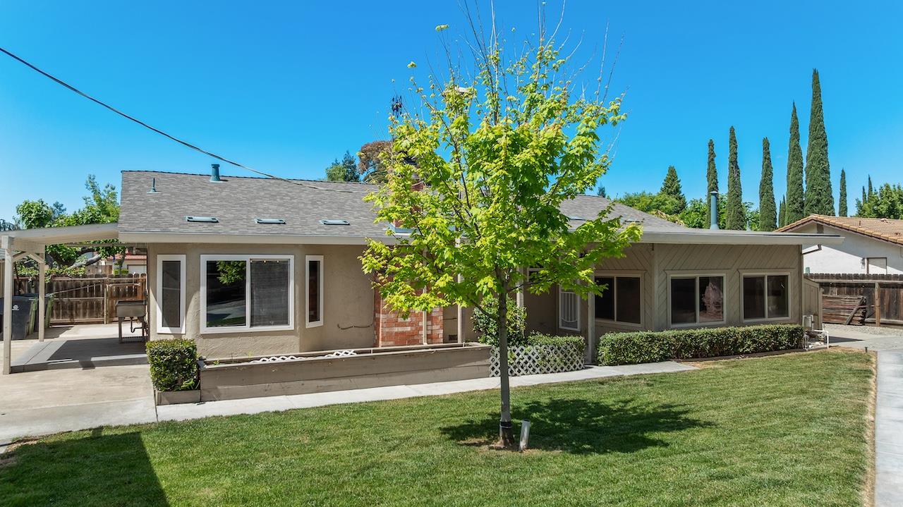 940 Constitution Way Tracy, CA 95376 - Photo 39 of 63 a view of a house with a yard and potted plants