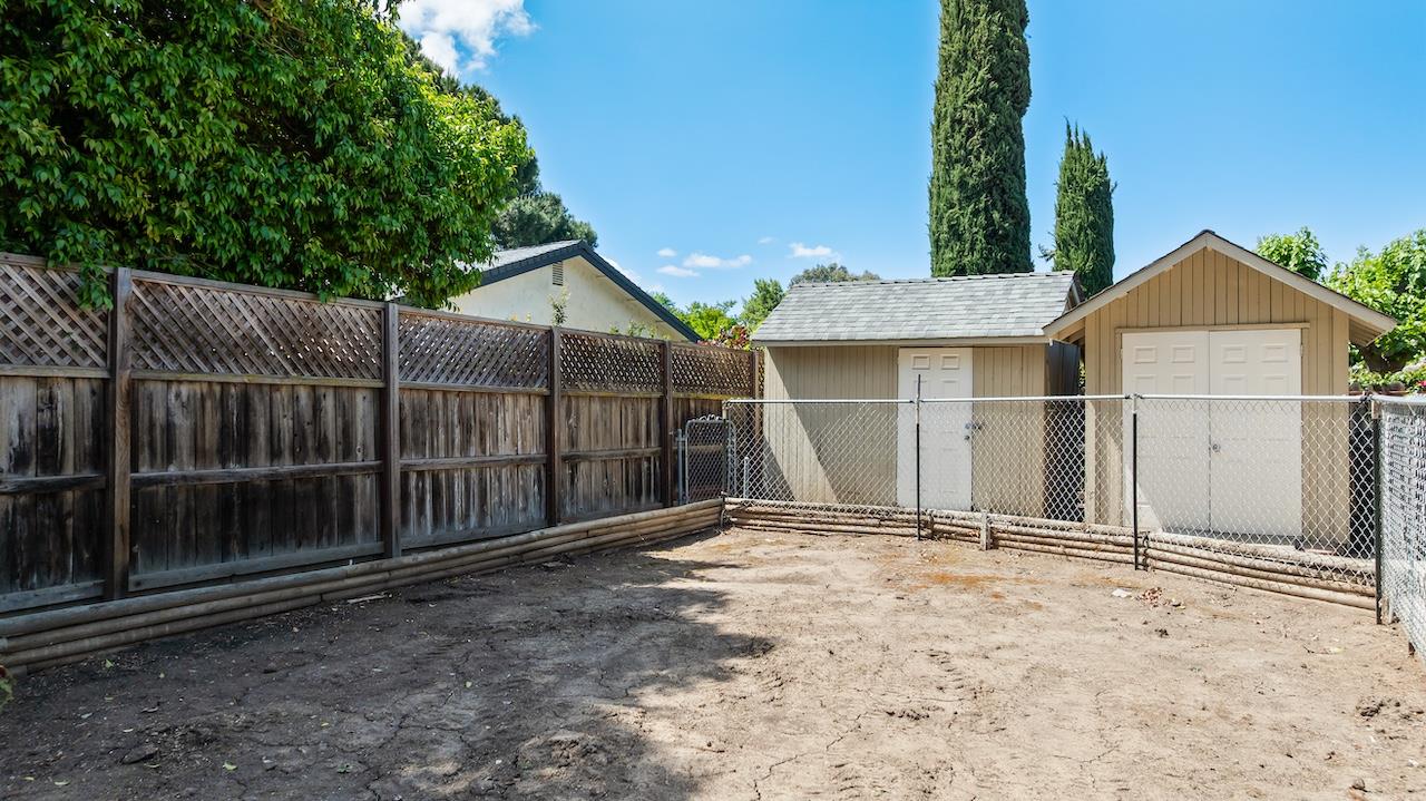 940 Constitution Way Tracy, CA 95376 - Photo 41 of 63 a view of a small house with wooden fence