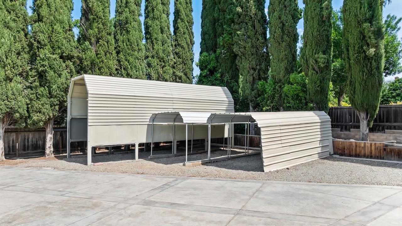 940 Constitution Way Tracy, CA 95376 - Photo 43 of 63 a view of a patio with a chair and tables