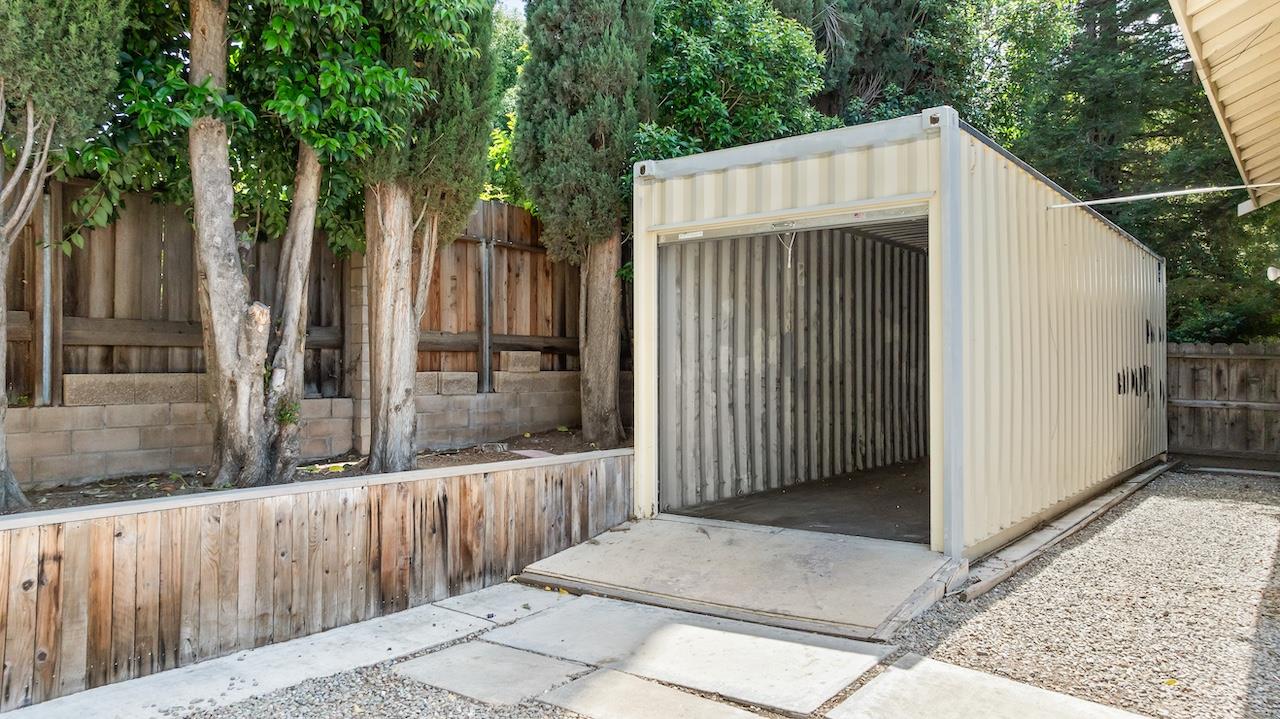 940 Constitution Way Tracy, CA 95376 - Photo 45 of 63 a view of a entrance gate of the house and tree