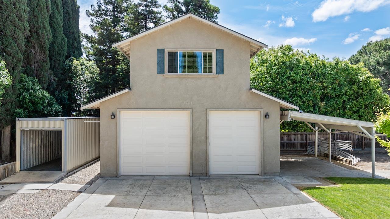 940 Constitution Way Tracy, CA 95376 - Photo 47 of 63 a front view of house with yard and trees in the background