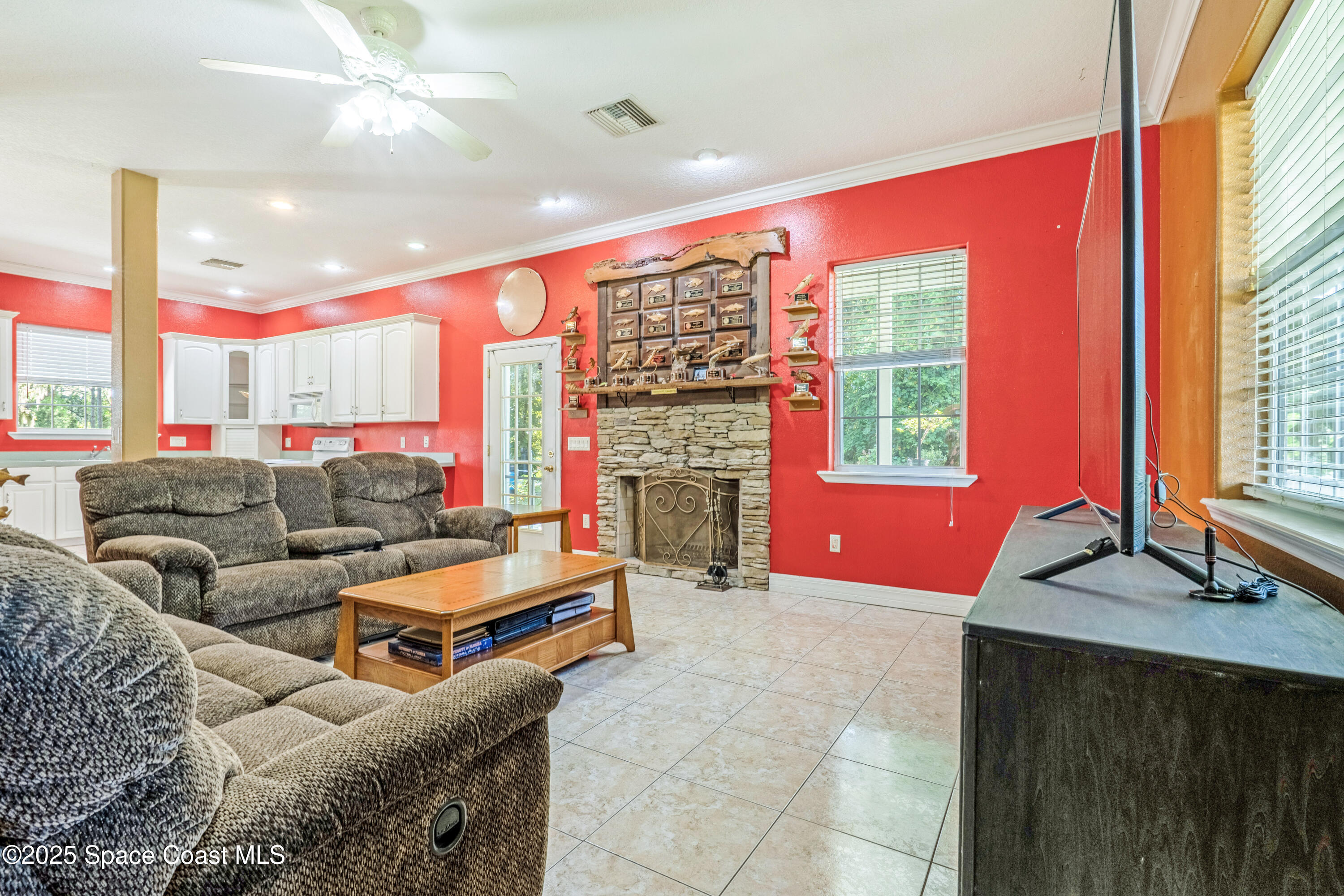 3931 U.S. Rte 1 Mims, FL 32754 - Photo 15 of 47 a living room filled with furniture and a fireplace