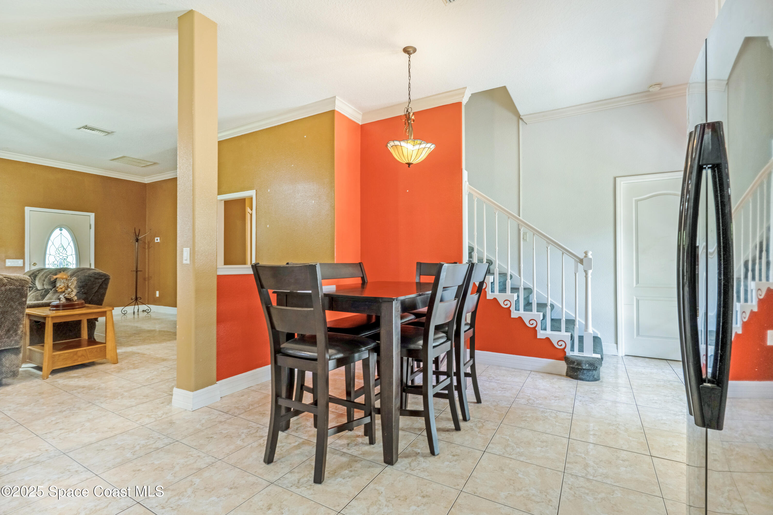 3931 U.S. Rte 1 Mims, FL 32754 - Photo 21 of 47 a dining room filled with furniture and a chandelier