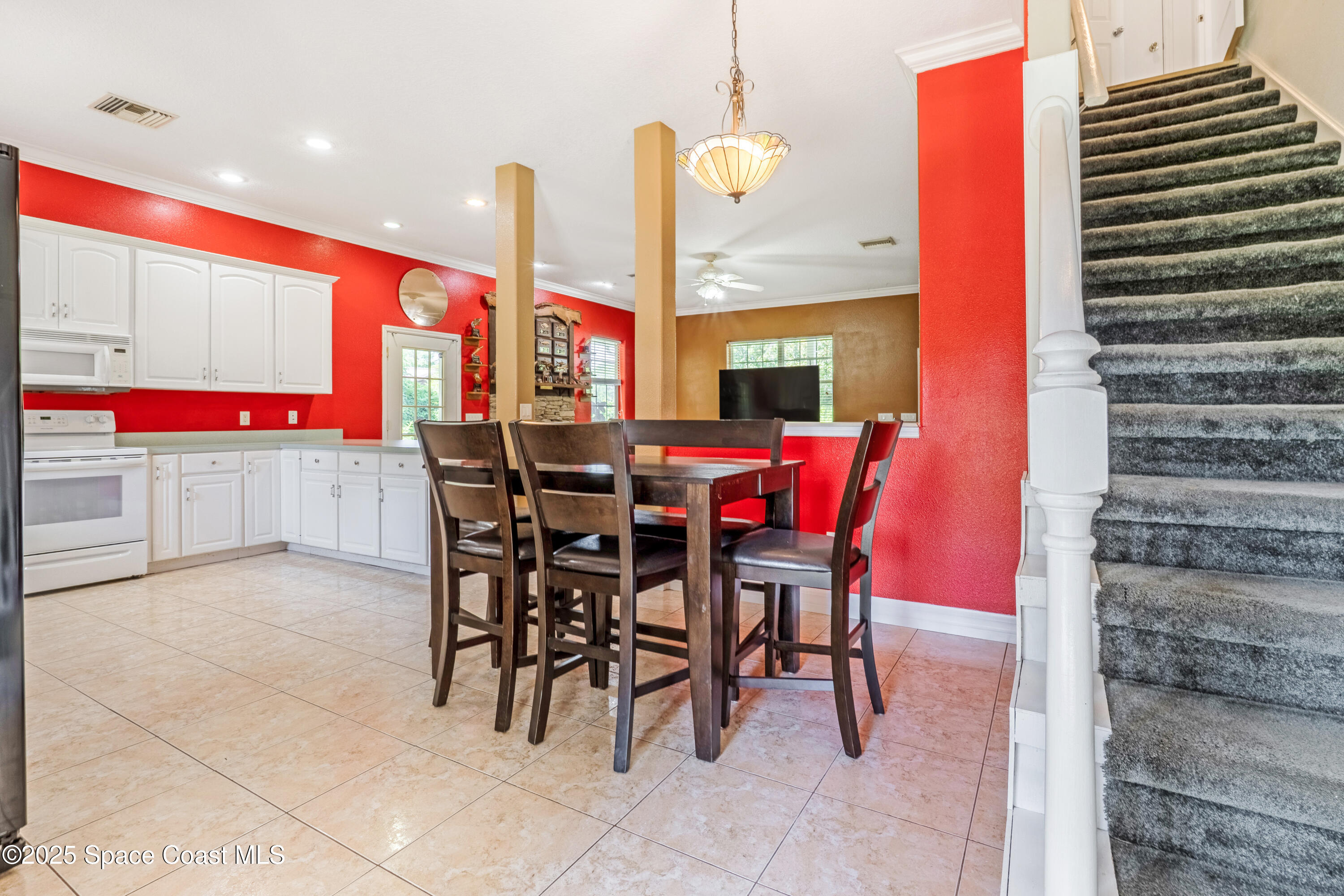 3931 U.S. Rte 1 Mims, FL 32754 - Photo 22 of 47 a dinning table and chairs in the kitchen