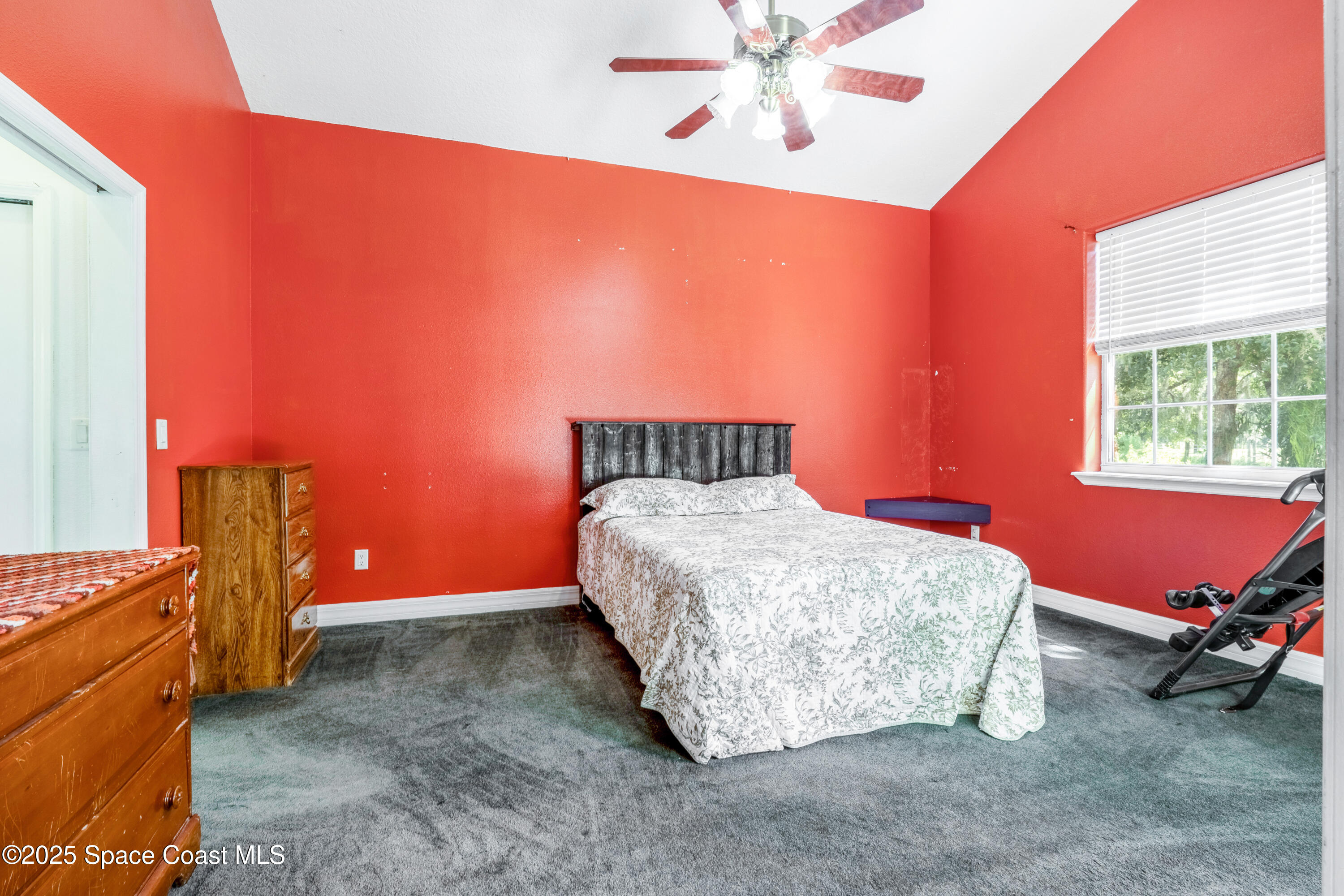 3931 U.S. Rte 1 Mims, FL 32754 - Photo 24 of 47 a bedroom with a bed and a window