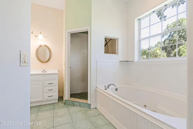 a bathroom with a bathtub and a sink