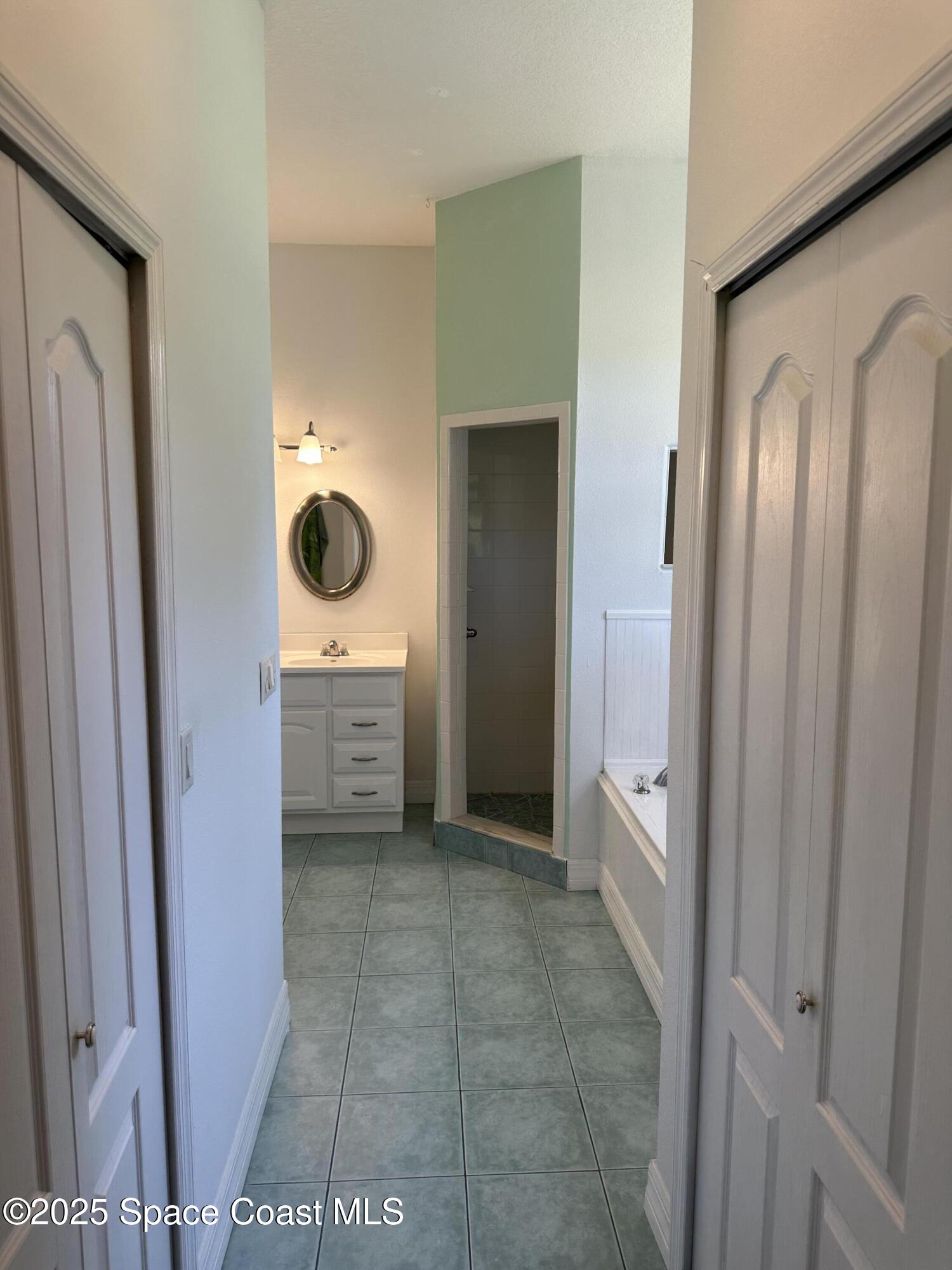 3931 U.S. Rte 1 Mims, FL 32754 - Photo 27 of 47 a bathroom with a sink and a mirror