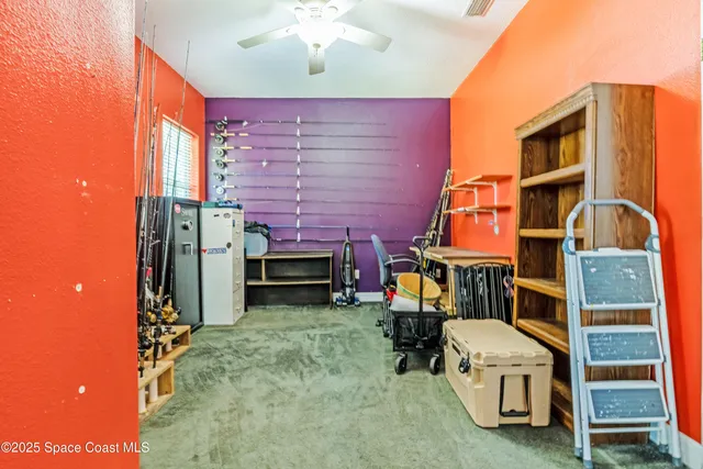 a view of a chairs with barbeque grill and a backyard