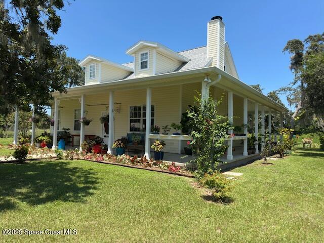 3931 U.S. Rte 1 Mims, FL 32754 - Photo 5 of 47 a front view of a house with a yard table and chairs